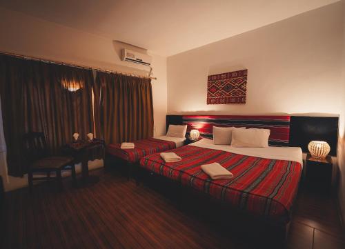 Postel nebo postele na pokoji v ubytování Pasha Boutique Hotel
