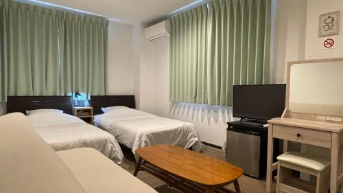 Llit o llits en una habitació de Hostel Inn Hashimoto