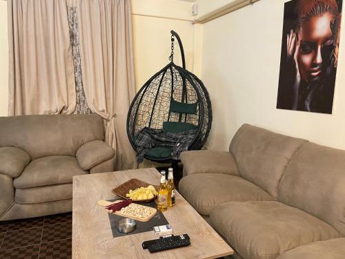 a living room with a couch and a table at Tsaghkazdor luxury apartment in Tsaghkadzor