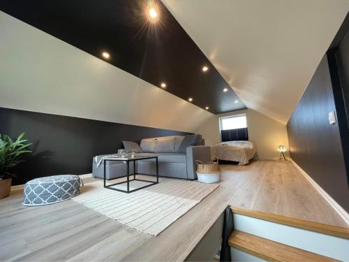 a living room with a couch and a table at Sauna House in Andenes