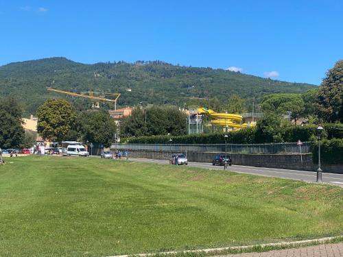 a street with a grass field next to a road at Il Rustico in Sansepolcro