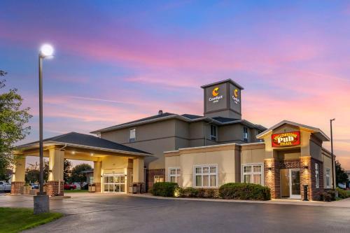 a building with a clock tower on top of it at Comfort Inn Plover-Stevens Point in Plover