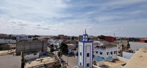 a view of a city with a clock tower at Dar Assalam in Oualidia