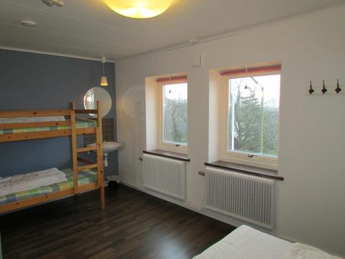 Rúm í herbergi á Hallandsåsen Hostel