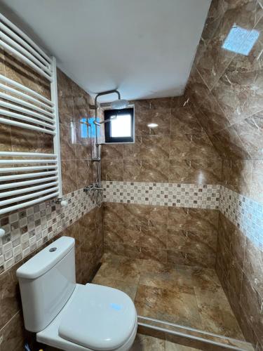 a bathroom with a toilet and a shower at Sno View in Sno