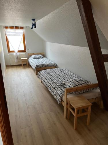 Ένα ή περισσότερα κρεβάτια σε δωμάτιο στο Maison Alsacienne