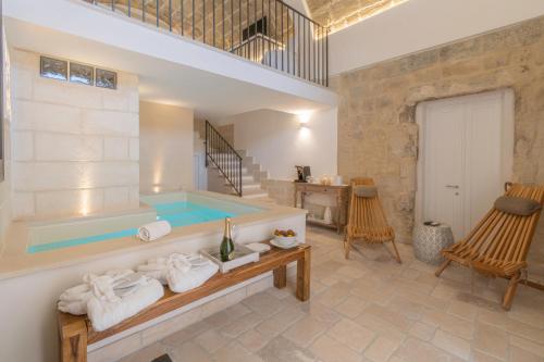 a wellness room with a hot tub in a villa at Masseria dei Monaci in Otranto