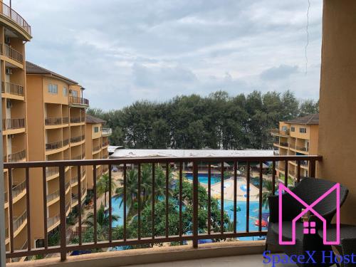 a view of the pool from a balcony at a resort at Gold Coast Morib Resort in Banting
