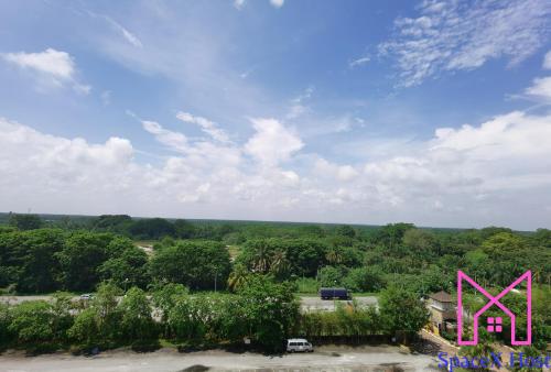 a view of a park with a pink bridge at Gold Coast Morib Resort in Banting