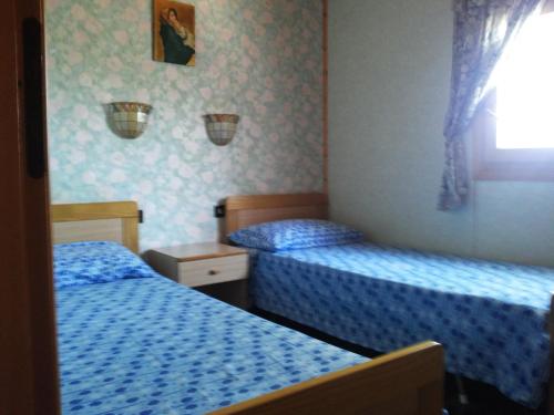 Postel nebo postele na pokoji v ubytování Punta Secca - DEGNO -