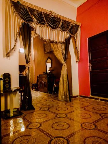 a living room with a curtain in a room at Safari Abu Simbel in Abu Simbel