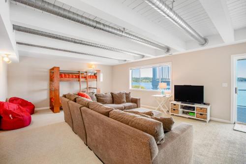 a living room with a couch and a television at Sound of Sight in Allyn
