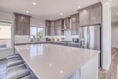 a kitchen with a large white counter top and wooden cabinets at Lincoln Landing in Lincoln City
