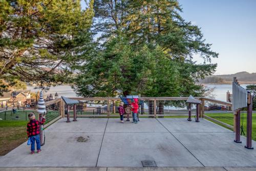 a group of children standing on a playground at Lincoln Landing in Lincoln City