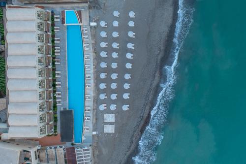 an overhead view of a parking lot next to the ocean at Giannoulis - Grand Bay Beach Resort (Exclusive Adults Only) in Kolymvari