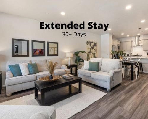 an extended stay sign in a living room at Modern Farmhouse Townhome - Great Central Location in Fort Collins