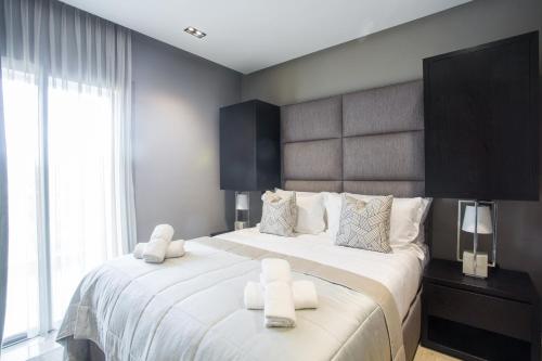 a bedroom with a large bed with white sheets at W-Aldorf in Casablanca