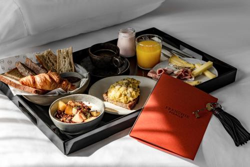 a tray of food with different foods on a table at Grand Pigalle Experimental in Paris