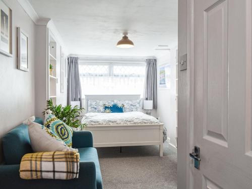 a small bedroom with a bed and a window at Sea Breeze in Cliftonville