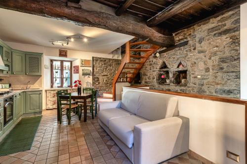 a living room with a couch and a table at Casa al Lago di Como in Riva Cernobbio in Cernobbio