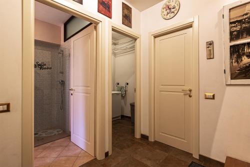 a bathroom with a walk in shower and a toilet at Casa al Lago di Como in Riva Cernobbio in Cernobbio