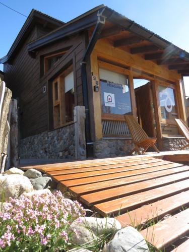 a wooden deck in front of a house at CasaEstudio in El Chalten