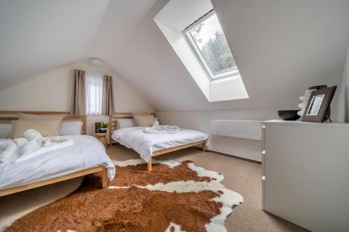 Postel nebo postele na pokoji v ubytování Rákosárna Suites & Apartments