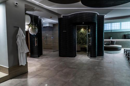 a lobby with a large room with a bathroom at Hotel Ariston & Spa in Montecatini Terme