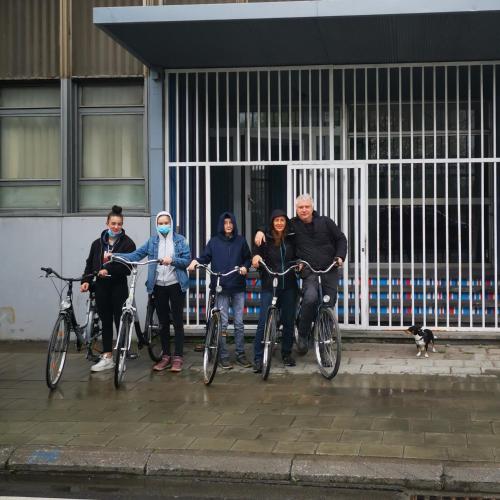 a group of people on bikes holding a ribbon at Adventure Alternative - GUEST HOUSE - Arts-Factory-Experience - For artists, makers and open minds - Attention, we are not a hotel and are not adapted for everybody - Read host warnings before reservation - PROVIDENCE,BE asbl in Charleroi