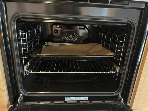 an oven with a pizza inside of it at Moderne, ruhige Ferienwohnung , ideal zum Abschalten in Hadamar