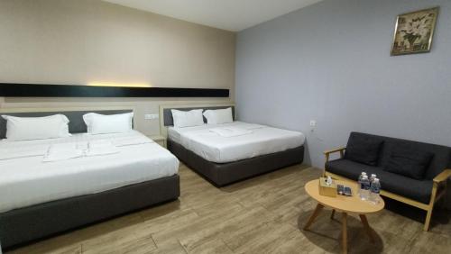 Postel nebo postele na pokoji v ubytování Unikarya Lodge