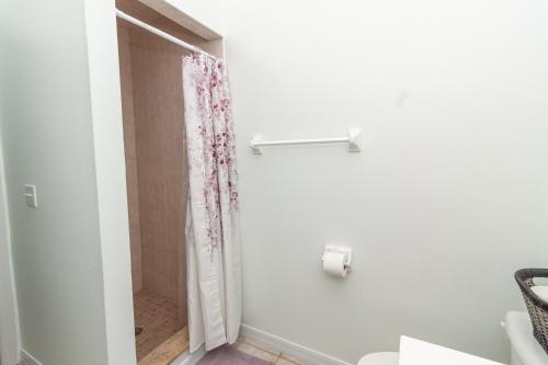 a bathroom with a shower with a shower curtain at Gorgeous Fully Furnished 2-Bedroom Luxury Villa in Kissimmee