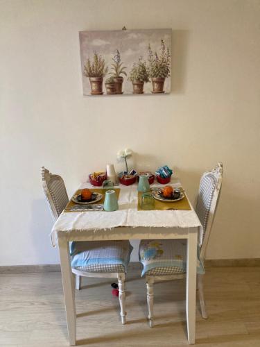a white table with plates of food on it at Antica Novi B & B in Novi Ligure