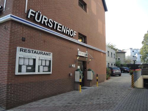 a brick building with a sign on the side of it at Hotel Fürstenhof in Braunschweig