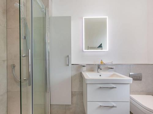 a white bathroom with a sink and a shower at Studio - Uk34126 in Tewkesbury