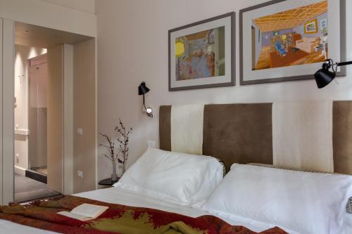 Een bed of bedden in een kamer bij MyNavona
