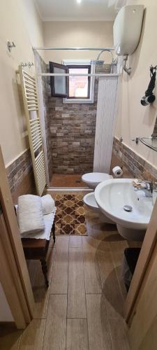a bathroom with a sink and a toilet and a shower at casale in Brindisi