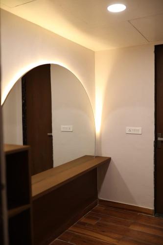 a dressing room with a mirror on the wall at Bamboo Saa Mulberry Resort Pushkar in Pushkar