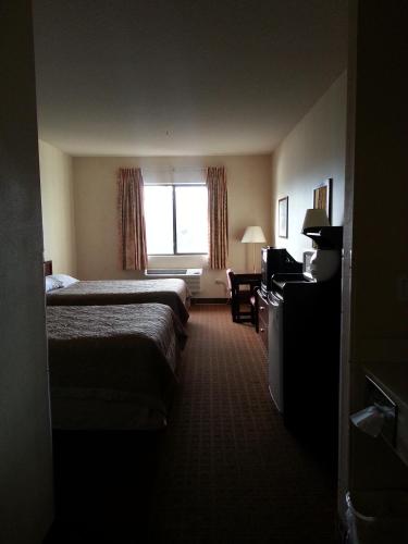 a hotel room with two beds and a window at Super 8 by Wyndham Page/Lake Powell in Page