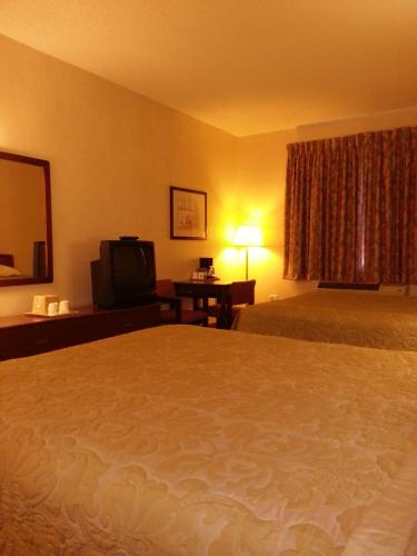a hotel room with a bed and a television at Super 8 by Wyndham Page/Lake Powell in Page