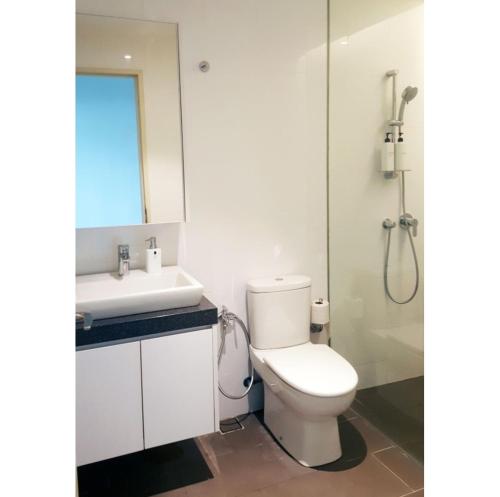 a bathroom with a toilet and a sink and a shower at KL Sentral Loft , EST Bangsar #2, LRT in Kuala Lumpur