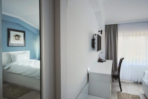 Postel nebo postele na pokoji v ubytování Hotel Callisto