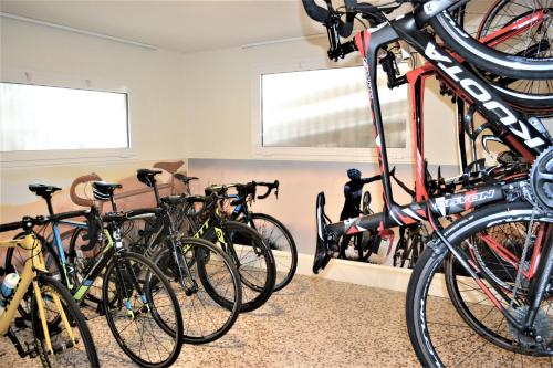 a group of bikes parked in a room at Hotel La Baia in Diano Marina
