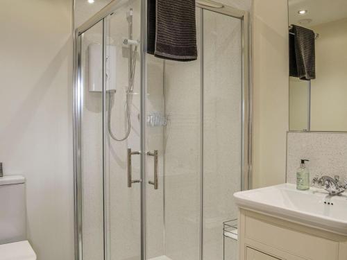 a bathroom with a shower and a sink and a toilet at The Old Mill in Fettercairn