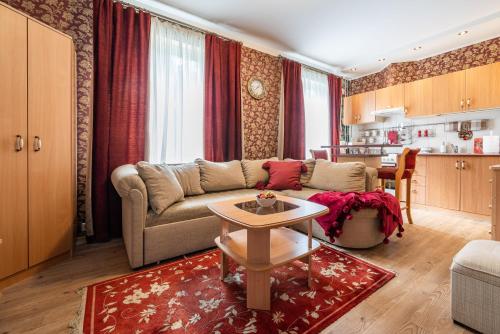 a living room with a couch and a table at Videviku Villa Apartments in Tallinn