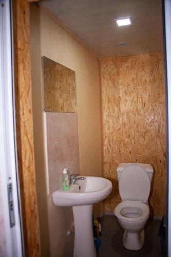 a bathroom with a toilet and a sink at B&B Sunrise House Aygavan in Aygavan