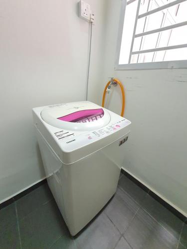 a white toilet with a pink seat in a bathroom at Condo @ Bukit Indah/ Legoland/ Eco Botanic 6 pax in Gelang Patah