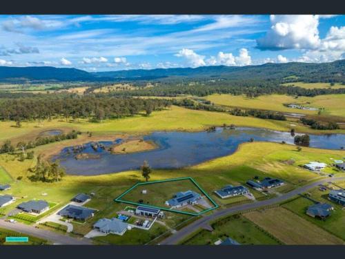 an aerial view of a park with a lake at Soulful Grande Manor with Mineral Pool in Millfield