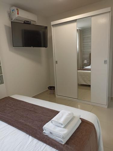 Una cama o camas en una habitación de Pousada Harmonia Pomerana