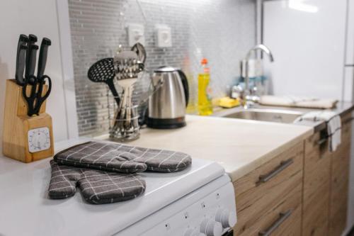 a kitchen counter with a sink and a counter top with towels at Anna Maria Medjugorje in Međugorje